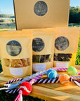 Healthy dehydrated pet treats and handcrafted toys in a gift box by Farmer Pete's.
