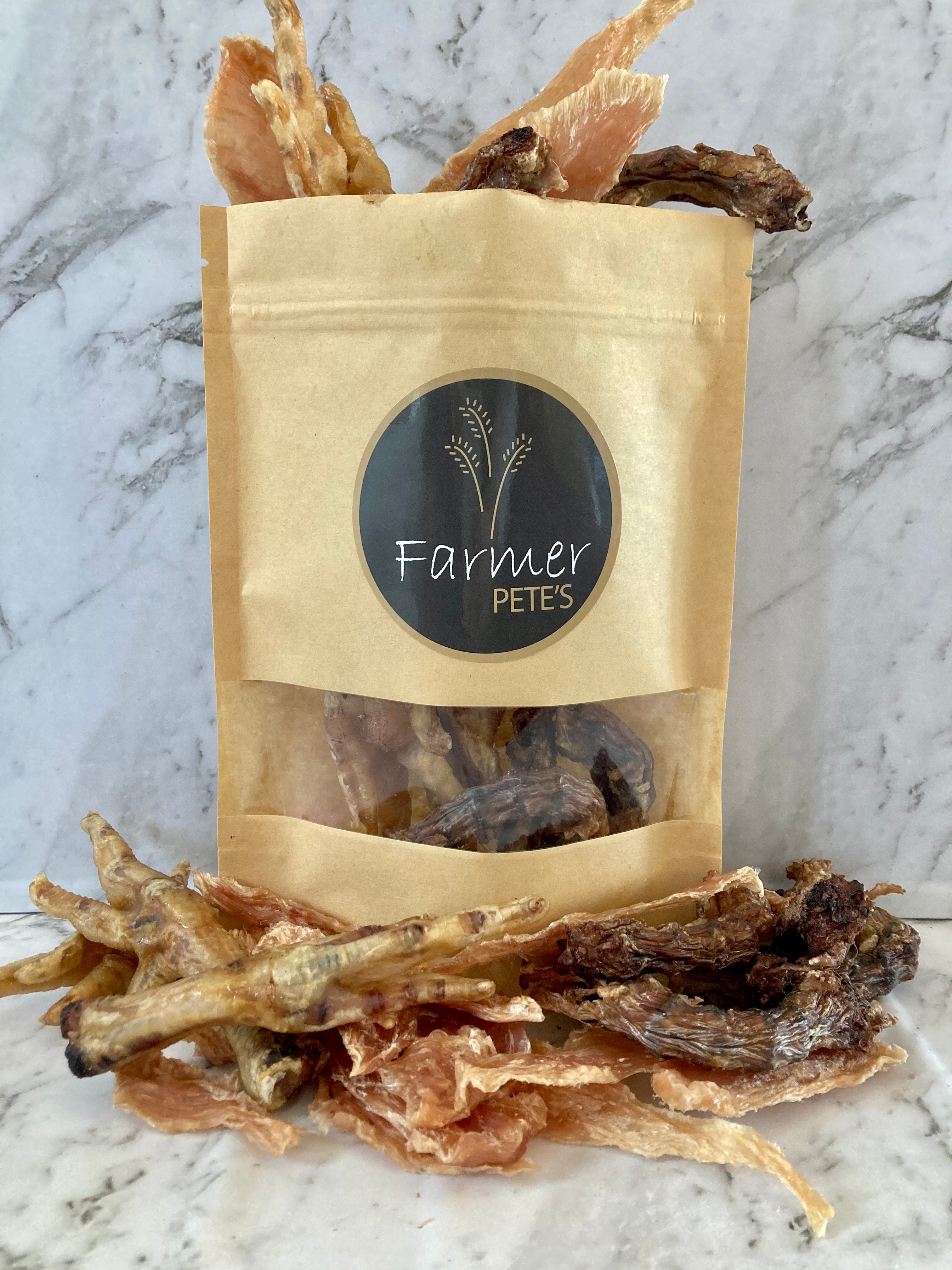 Assortment of dehydrated All-natural Chicken Breast Jerky, Jerky Bites, Feet and Necks for pet treats by Farmer Pete&#39;s