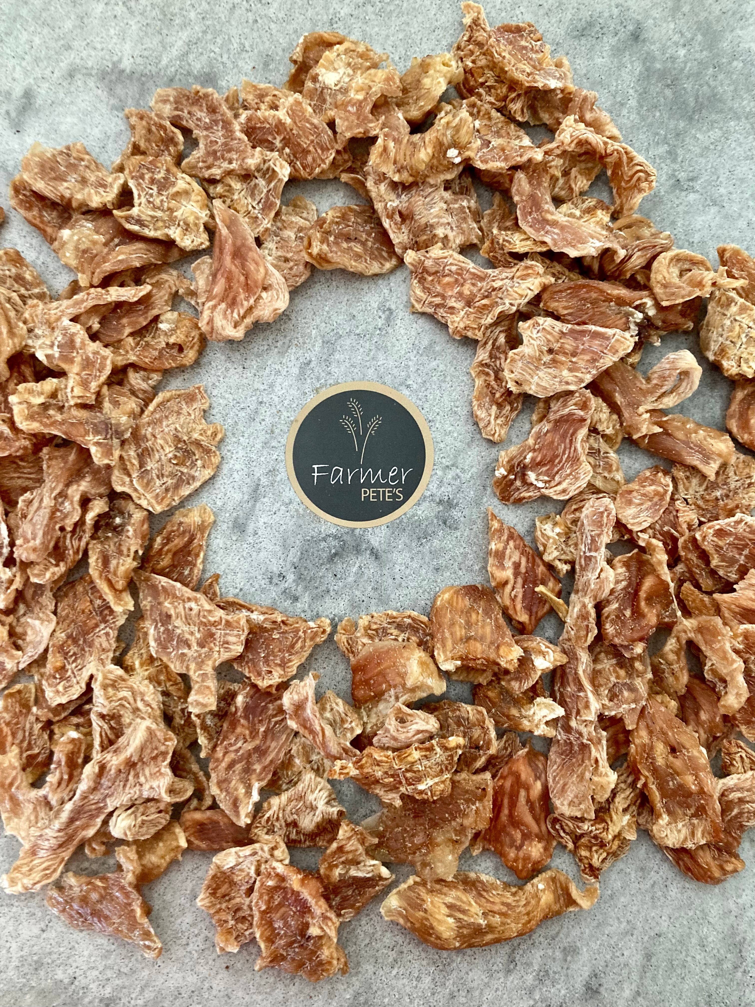 Farmer Pete&#39;s Natural dehydrated chicken jerky bites for pets.