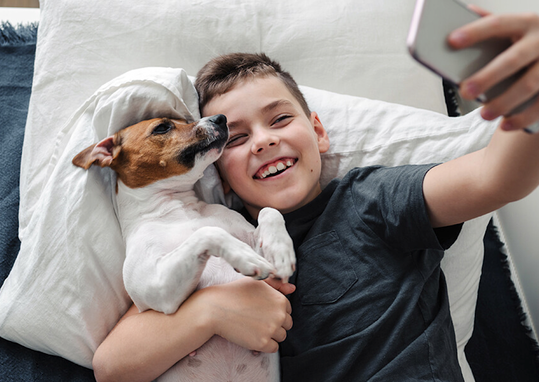 Dog and boy growing up together, taking a selfie
