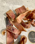 Pigs ear strip chewy treats for dogs by Farmer Pete's.