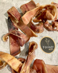 Farmer Pete's natural pigs ear strip chewy dog treats.