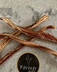 Close up view of Farmer Pete's beef puzzle / bully stick standard and short.