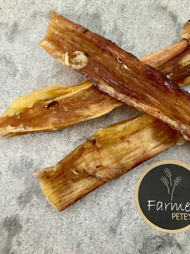 Close up of a beef Paddywack, dog chew treats by Farmer Pete's.