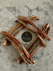 Beef pizzle / bully sticks by Farmer Pete's arranged in a diamond.